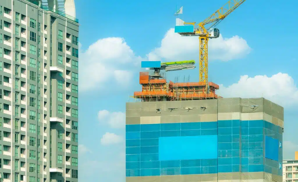 Construction site with crane and skyscraper building. Real estate industry. Crane in construction